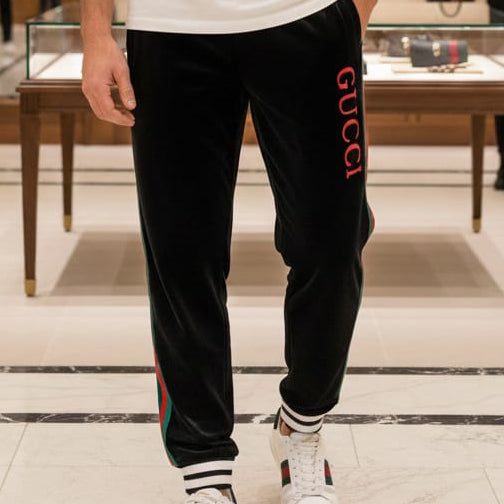 Black Luxury Velvet Track Pants with Green–Red Stripes & Bold Logo