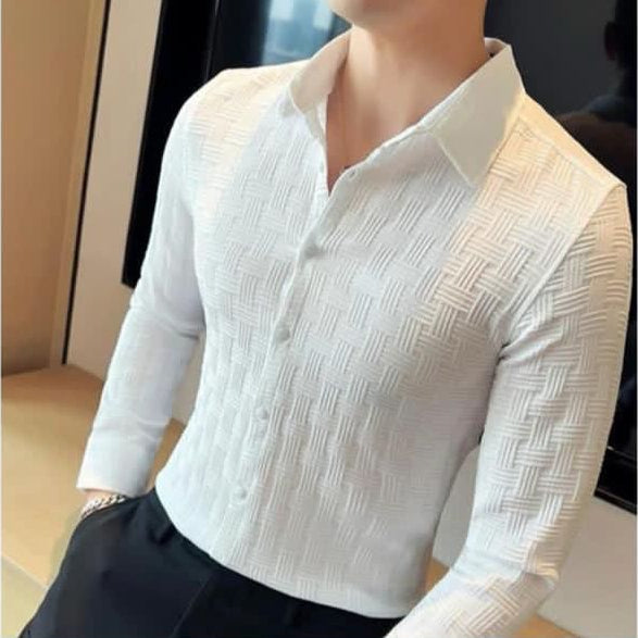 White textured long-sleeve shirt on a mannequin with a blurred background