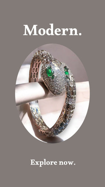 Elegant Emerald-Eyed Silver Snake Bracelet with Crystal Detailing
