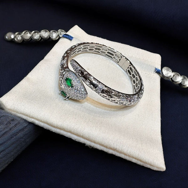 Elegant Emerald-Eyed Silver Snake Bracelet with Crystal Detailing