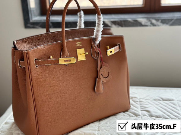 Elegant Taupe Leather Structured Handbag with Gold-Tone Hardware