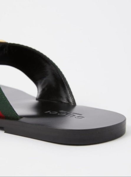 Stylish Black Flat Sandals with Signature Stripe Strap & Gold Logo Detail